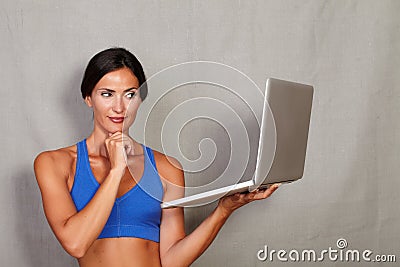 Adult long hair female holding laptop computer Stock Photo