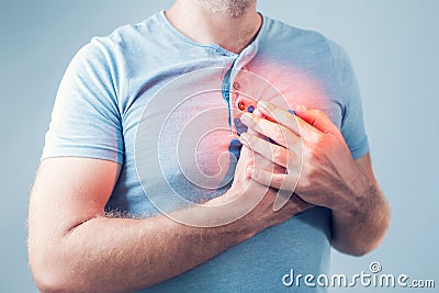 Adult male with heart attack or heart burn condition, health and Stock Photo