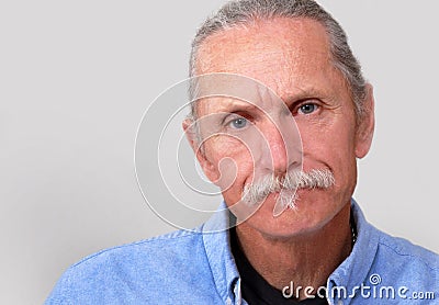 Adult male looking worried, on white background. Stock Photo