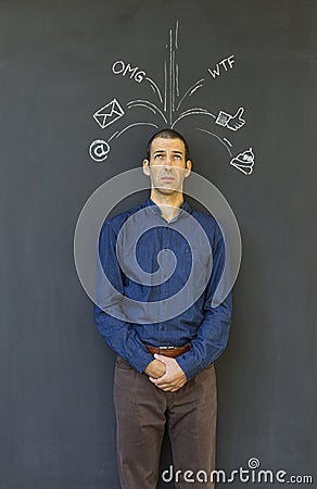 Adult man frustrated and stressed from social media overload Stock Photo