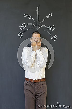 Adult man frustrated and stressed from social media overload Stock Photo