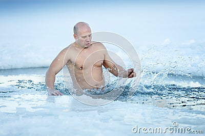 Adult man swimming icy winter water Stock Photo