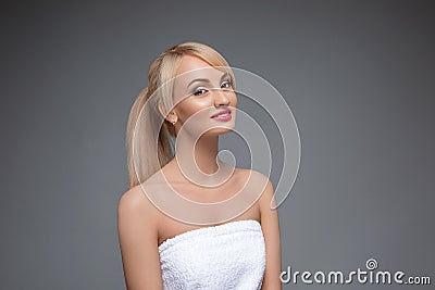 Adult portrait of a woman, concept of skin care, beautiful skin. Portrait of a girl on a gray neutral background. beauty Stock Photo