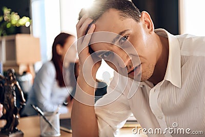 Adult puzzled man makes decision about signing marriage dissolution agreement. Stock Photo