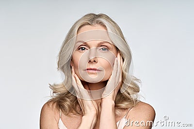 Portrait of beautiful 50 years old woman with perfect skin on white. Stock Photo