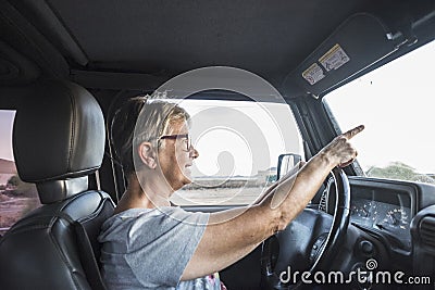 Adult senior woman drive the car Stock Photo