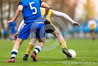 Adult Soccer Players Compete in a Tournament Match. Footballers in a Duel Stock Photo