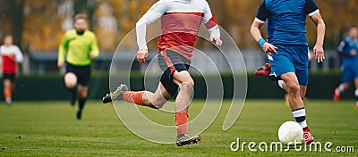 Adult Soccer Players in a Duel. Two College Soccer Teams Playing Soccer League Game. Two Football Players Competing in a Game Stock Photo