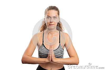 Adult sportive woman holding hands together as faithful gesture Stock Photo