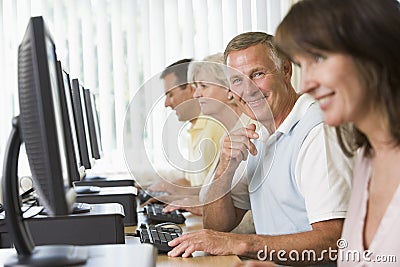 Adult students in a computer lab Stock Photo