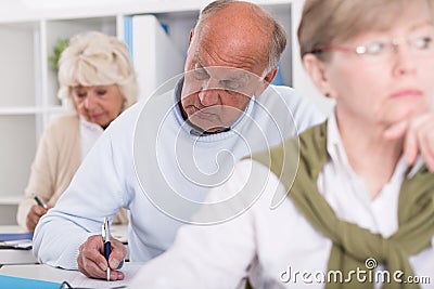 Adult students having test Stock Photo