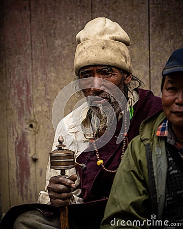 Adult Tibetan Buddhist worshiper with prayer beads at Tiji Festival in ancient Lo Manthang Editorial Stock Photo