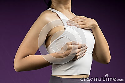 Woman do breast self exam Stock Photo