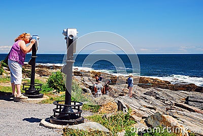 An adult woman looks through a view finder Editorial Stock Photo