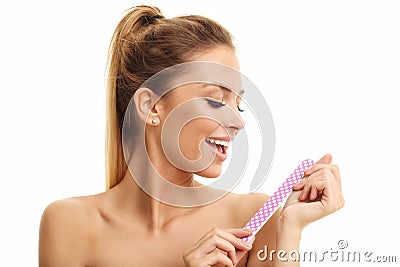 Adult woman polishing fingernails with the nail file Stock Photo