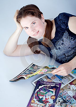 Adult woman reading comics books Editorial Stock Photo