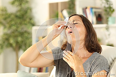 Adult woman sweating suffering heat stroke at home Stock Photo