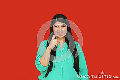 Adult woman uses Mexican Sign Language as a person with a hearing disability to communicate, seeks opportunities for inclusion Stock Photo