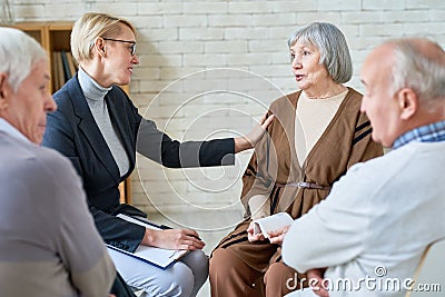 Woman consoling senior patients on meeting Stock Photo