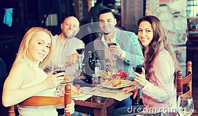 Adults having dinner in restaurant Stock Photo