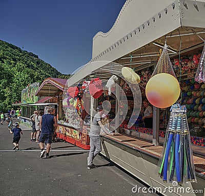 Adults and kids attend a Kermis or fair in the tourist town of Boppard, Germany, in the Middle Rhine River region. Editorial Stock Photo