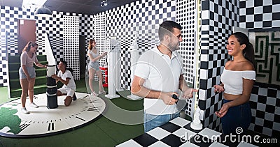 Adults which divided into groups are trying to get out of the escape room Stock Photo