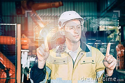 advance industry engineer male using hologram graphics interface for modern technology industrial concept Stock Photo