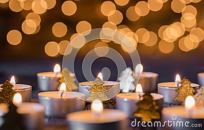 Advent and christmas background with candlelight, blurred lights and ornaments Stock Photo