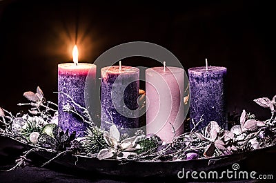One burning candle on advent wreath Stock Photo