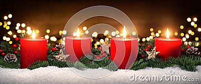 Advent decoration with four burning candles Stock Photo