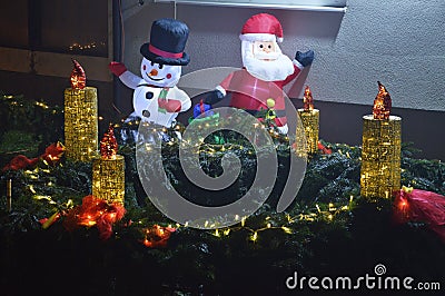 Figures snow white and santa claus and the fourth advent candle in the bistarac Stock Photo