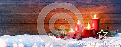 Advent Season - Four Red Candles On Snow Stock Photo