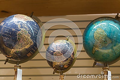 Adventure stories background. Old globe on map background. Stock Photo