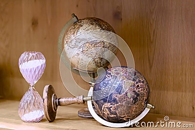 Adventure stories background. Old globe on map background. Stock Photo