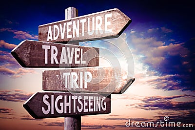 Adventure, travel, trip, sightseeing - wooden signpost, roadsign with four arrows Stock Photo