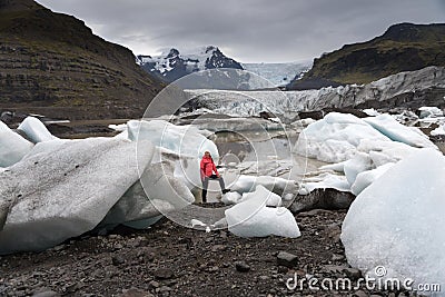 Young woman visiting nature landscape in Iceland glacier Stock Photo
