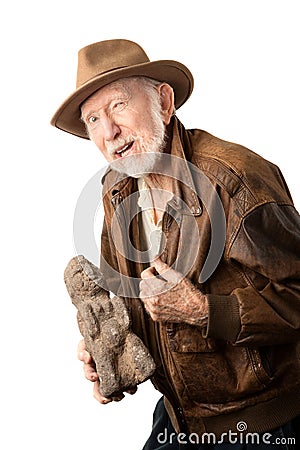 Adventurer or archaeologist offering to sell idol Stock Photo
