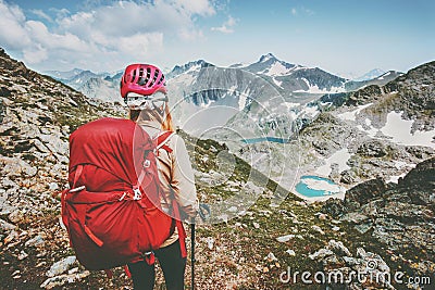 Adventurer tourist hiking in mountains with backpack Travel Lifestyle hiking adventure concept summer vacations outdoor exploring Stock Photo