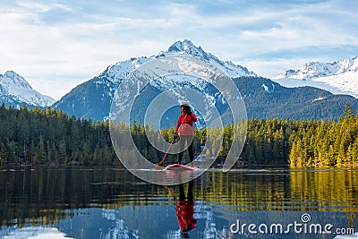 Adventurous Girl Paddle Boarding on Levette Lak Stock Photo