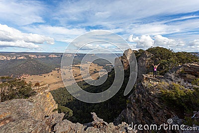 Adventurous hiker explorer reaching the top slab of Donkey Mountain Stock Photo