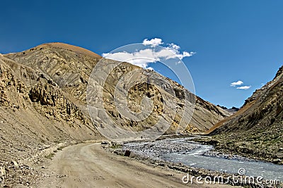 Adventurous road through besides river and mountains with clear Stock Photo