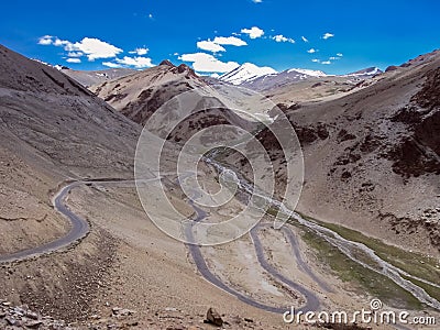 Adventurous road looping through mountains with clear blue sky on Manali to Leh highway in India Stock Photo