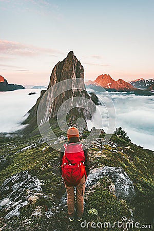 Adventurous woman enjoying sunset Segla mountain Stock Photo