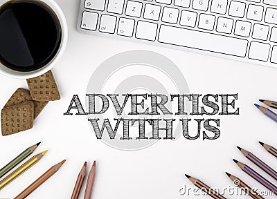 Advertise With Us. White office desk Stock Photo