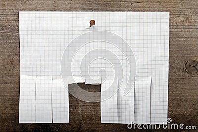 Advertisement paper with cut slips on wooden background Stock Photo