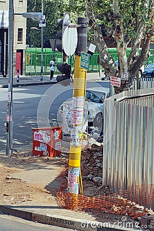 Advertisements on a utility pole in Johannesburg Editorial Stock Photo