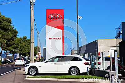 Kia Motors, totem and car. Editorial Stock Photo