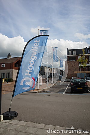 Advertising flags for Hoogvliet in customer car park showing company logo, braning and signage Editorial Stock Photo