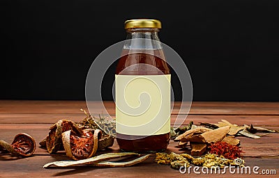 Advertising glass bottle of healthy beverage from natural herb and organic fruit extract for refreshment spa and detox treatment Stock Photo