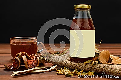 Advertising glass bottle of healthy beverage from natural herb and organic fruit extract for refreshment spa and detox treatment Stock Photo